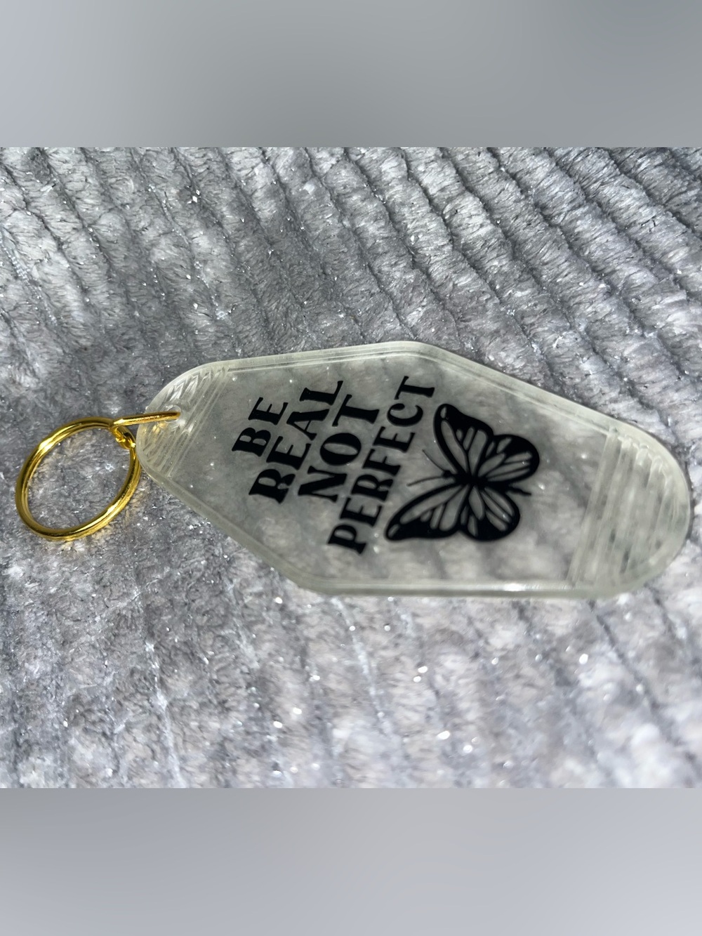 Clear Acrylic Keychain with 'Be Real Not Perfect' Black Print